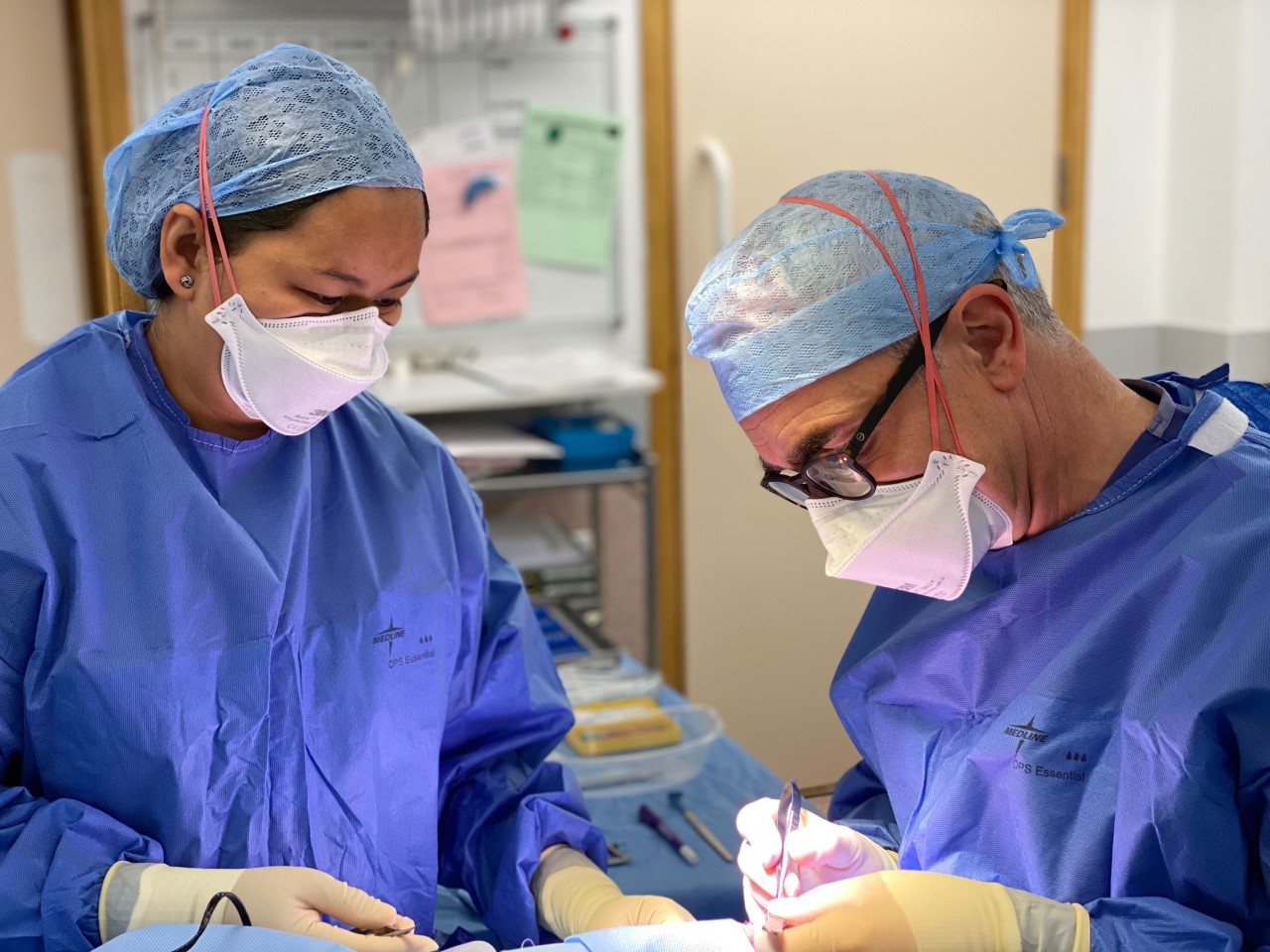 Hugo Henderson performing a procedure